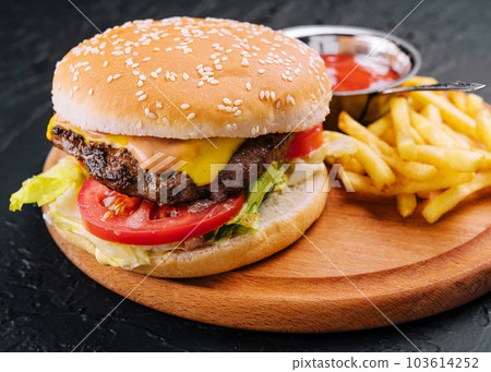 Fresh burger with french fries on wood 103614252