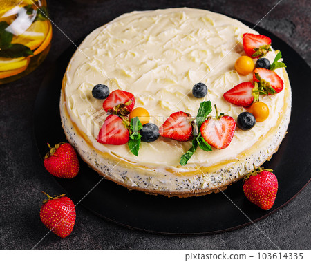 cheesecake with poppy seeds decorated with fresh strawberries cheesecake with poppy seeds decorated with fresh strawberries 103614335