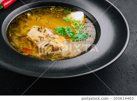 Chicken noodle soup in black plate 103614463