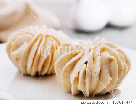 closeup vanilla cream on white plate closeup vanilla cream on white plate 103614474
