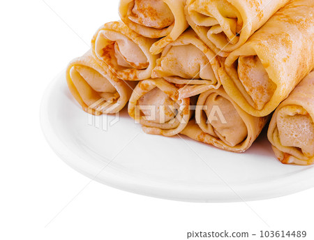 Stack of crepes rolls twisted with meat Stack of crepes rolls twisted with meat 103614489