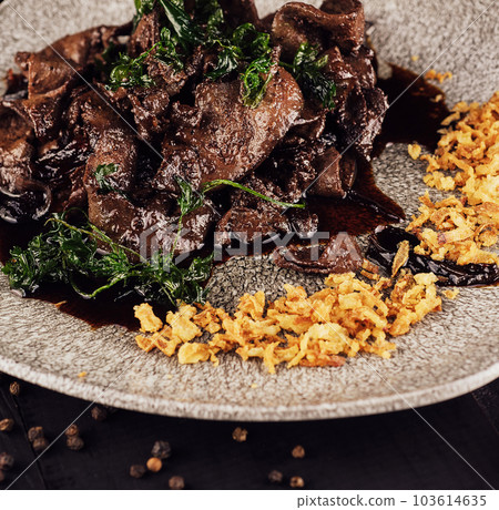 Beef liver with onions chips on plate Beef liver with onions chips on plate 103614635