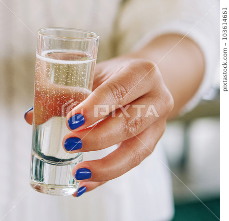 Glass of star martini in the hands of a girl Glass of star martini in the hands of a girl 103614661