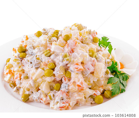 salad Olivier with mayonnaise on plate 103614808