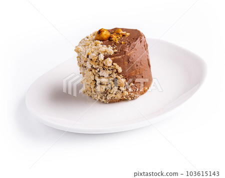 Kiev cake with walnuts on white plate 103615143