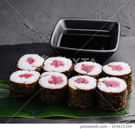 Maki rolls with tuna on black stone 103615164