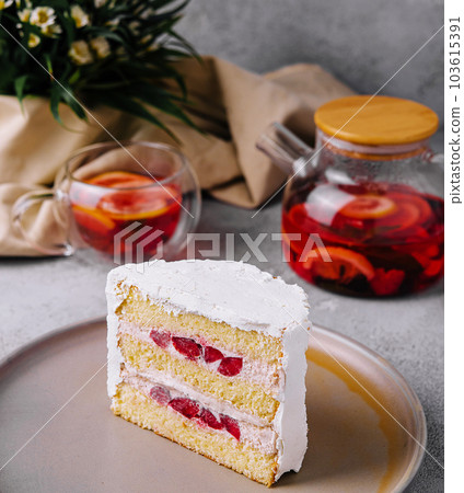 Biscuit cake with strawberry filling and tea Biscuit cake with strawberry filling and tea 103615391