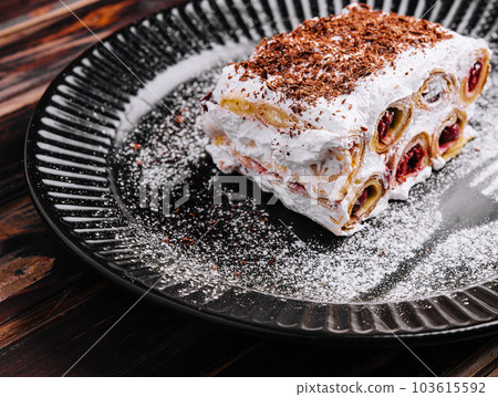 slice forest cake on black plate slice forest cake on black plate 103615592