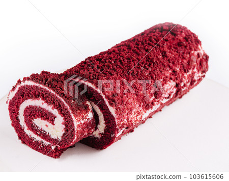 Sponge Swiss roll on white plate Sponge Swiss roll on white plate 103615606