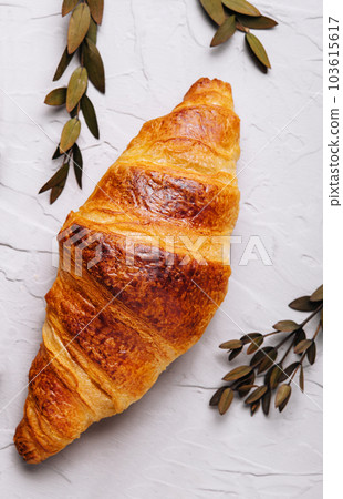 Sweet croissant on stone on top view 103615617