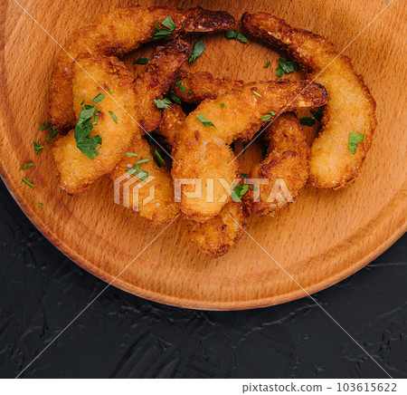 Fried shrimps or prawns with sauce on board 103615622