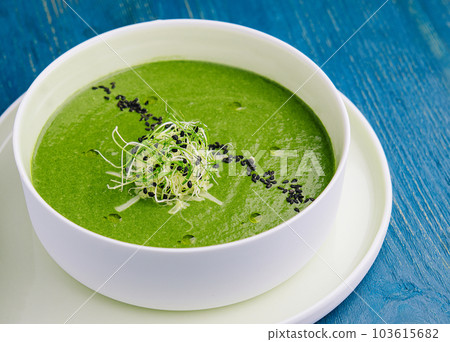 Plate of broccoli and green peas cream soup Plate of broccoli and green peas cream soup 103615682