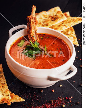 Claypot of spare rib soup on white bowl 103615858