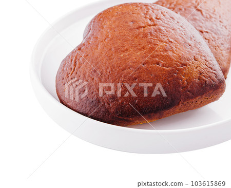 Closeup of two of heart-shaped cookies on plate Closeup of two of heart-shaped cookies on plate 103615869