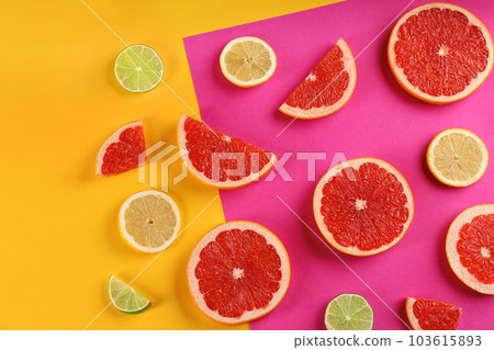 Flat lay composition with tasty ripe grapefruit slices on color background Flat lay composition with tasty ripe grapefruit slices on color background 103615893