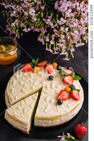 poppy seed cheesecake with berries top view 103615894