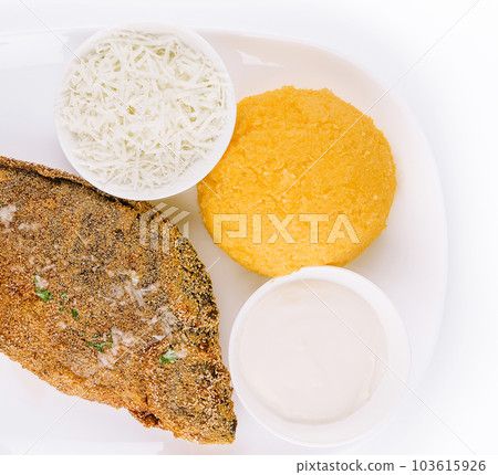 Traditional Moldavian porridge made from hominy and fish with goat cheese 103615926