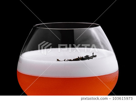 Refreshing alcoholic cocktail with egg foam in a glass 103615973