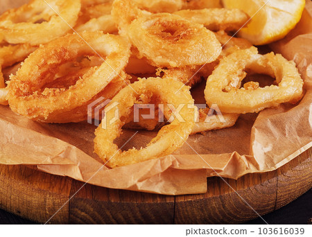 Oven baked breaded calamari rings served 103616039