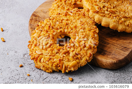 cookies with nut chips and a glass of milk with a bottle 103616079