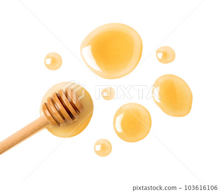 Drops of honey and dipper on white background, top view 103616106