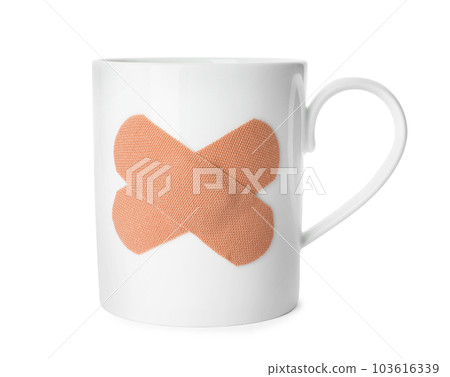 Cup with sticking plasters isolated on white 103616339