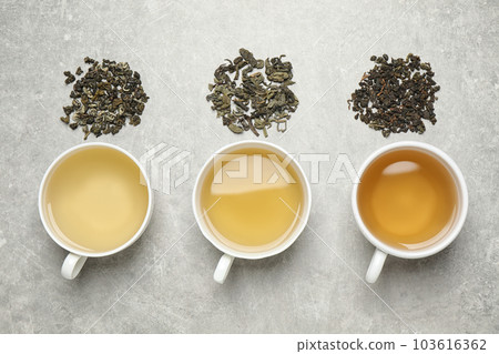 Flat lay composition with green tea on grey table Flat lay composition with green tea on grey table 103616362