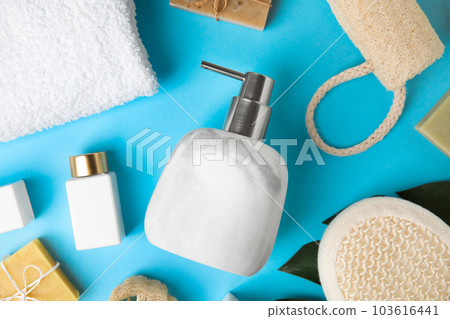 Flat lay composition with marble soap dispenser on light blue background Flat lay composition with marble soap dispenser on light blue background 103616441