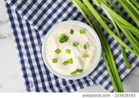 Fresh sour cream with onion on fabric, flat lay 103616585