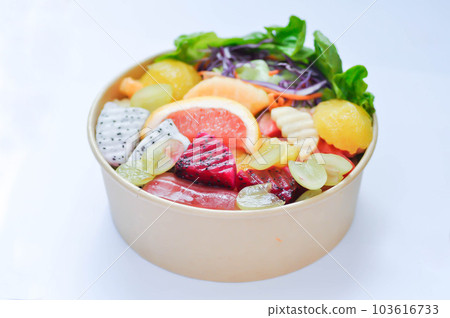 fruit and vegetable salad or orange, dragon fruit and lettuce salad 103616733