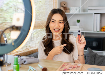 Beautiful women with social media influences recommend products and make-up accessories to be more beautiful, Recording vlog video live streaming, Online business of beauty bloggers.  103617057