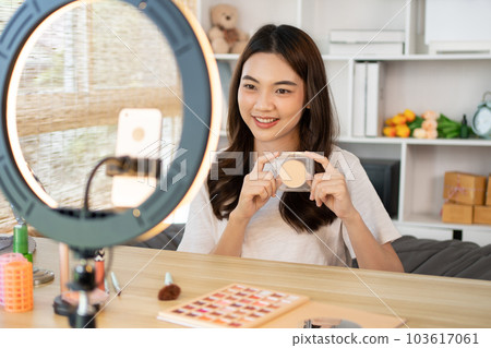 Beautiful women with social media influences recommend products and make-up accessories to be more beautiful, Recording vlog video live streaming, Online business of beauty bloggers. Beautiful women with social media influences recommend products and make-up accessories to be more beautiful, Recording vlog video live streaming, Online business of beauty bloggers. 103617061