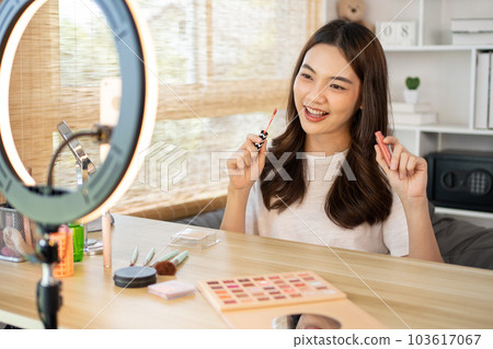 Beautiful women with social media influences recommend products and make-up accessories to be more beautiful, Recording vlog video live streaming, Online business of beauty bloggers. Beautiful women with social media influences recommend products and make-up accessories to be more beautiful, Recording vlog video live streaming, Online business of beauty bloggers. 103617067