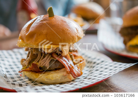 Close up of Bacon and Cheese Burger on plate 103617166