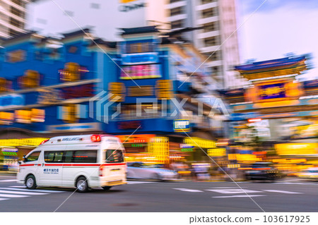 Cityscape of Yokohama, Japan An ambulance passing in front of Chaoyangmon, Yokohama Chinatown with its siren sounding (night view) = June 3 103617925