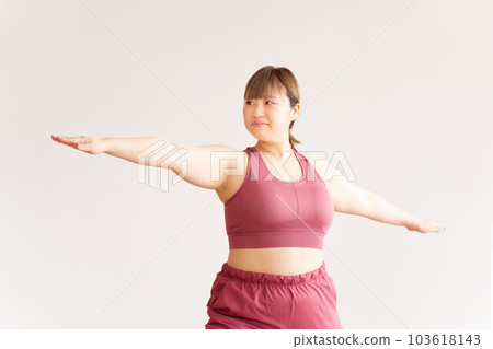 Chubby young woman doing yoga plus size model image Chubby young woman doing yoga plus size model image 103618143