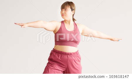 Chubby young woman doing yoga plus size model image Chubby young woman doing yoga plus size model image 103618147