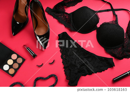 Flat lay composition with sexy women's underwear on red background Flat lay composition with sexy women's underwear on red background 103618163