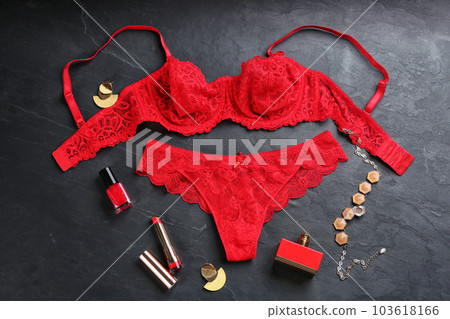 Flat lay composition with women's underwear on black stone background Flat lay composition with women's underwear on black stone background 103618166
