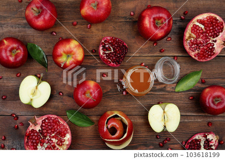 Honey, apples and pomegranate on wooden table, flat lay. Rosh Hashanah holiday 103618199