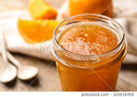 Homemade delicious orange jam on table, closeup view 103618468