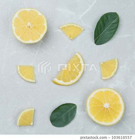 Flat lay composition with lemon slices on grey marble table 103618557