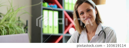 Happy smiling female practitioner posing in clinic office Happy smiling female practitioner posing in clinic office 103619114