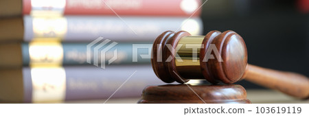 Judge gavel or hammer on sounding block and stack of law books Judge gavel or hammer on sounding block and stack of law books 103619119