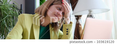 Tired woman working using modern laptop in office Tired woman working using modern laptop in office 103619120