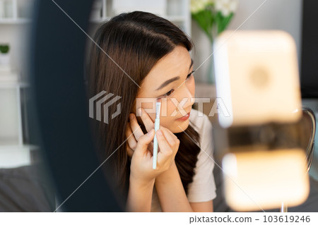 Beautiful women with social media influences are teaching makeup and use cosmetics, In front of the camera to recording vlog video live streaming, Online business on concept of beauty bloggers. 103619246