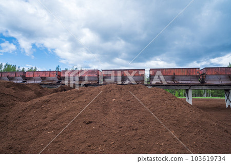 peat transport wagons at the loading point. Raised platform for loading and unloading peat. 103619734