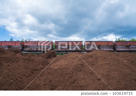 peat transport wagons at the loading point. Raised platform for loading and unloading peat. 103619735