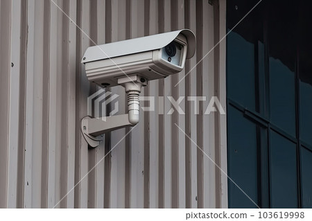 Security camera on modern building. CCTV on the wall in the city. Generative AI Security camera on modern building. CCTV on the wall in the city. Generative AI 103619998