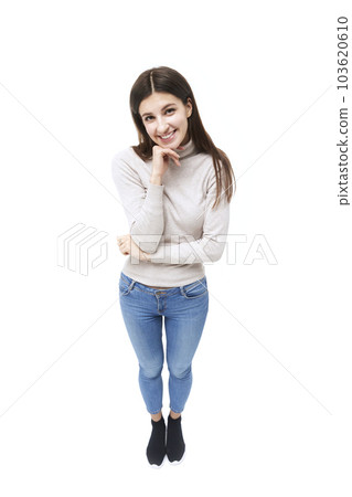 studio portrait of a beautiful caucasian woman, looking at camera smiling, high angle view 103620610